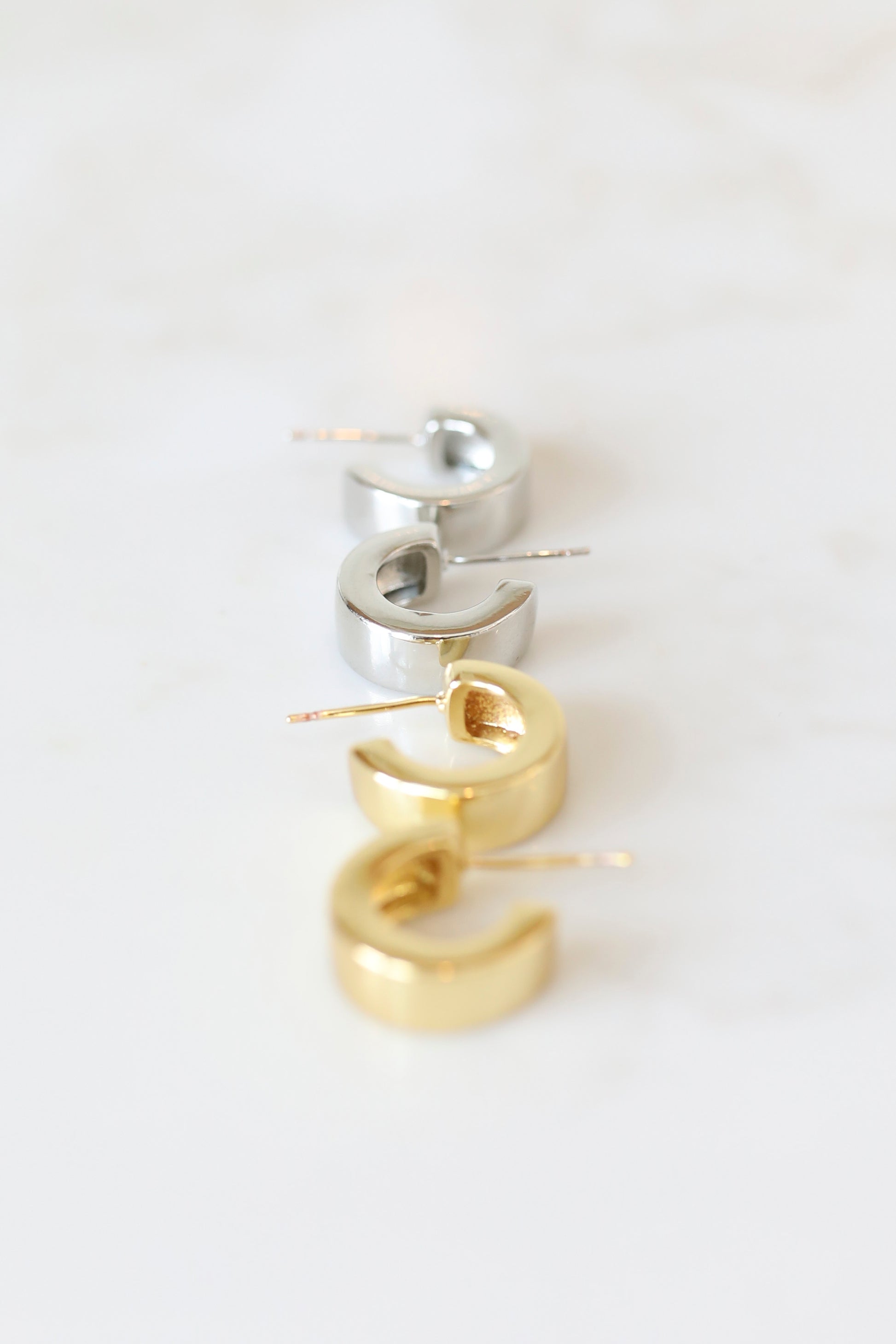 Thick Huggie Hoops available in Gold or Silver