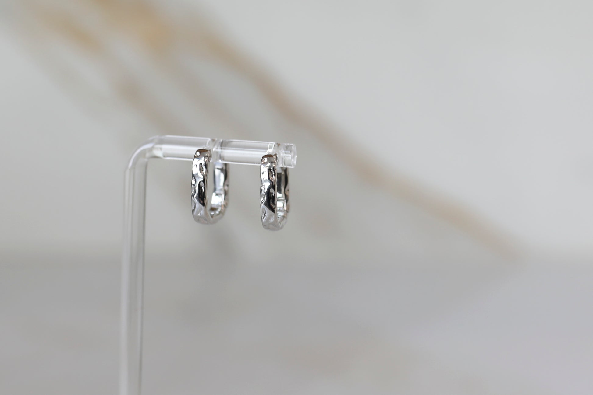 Hammered Huggie Hoops in Silver