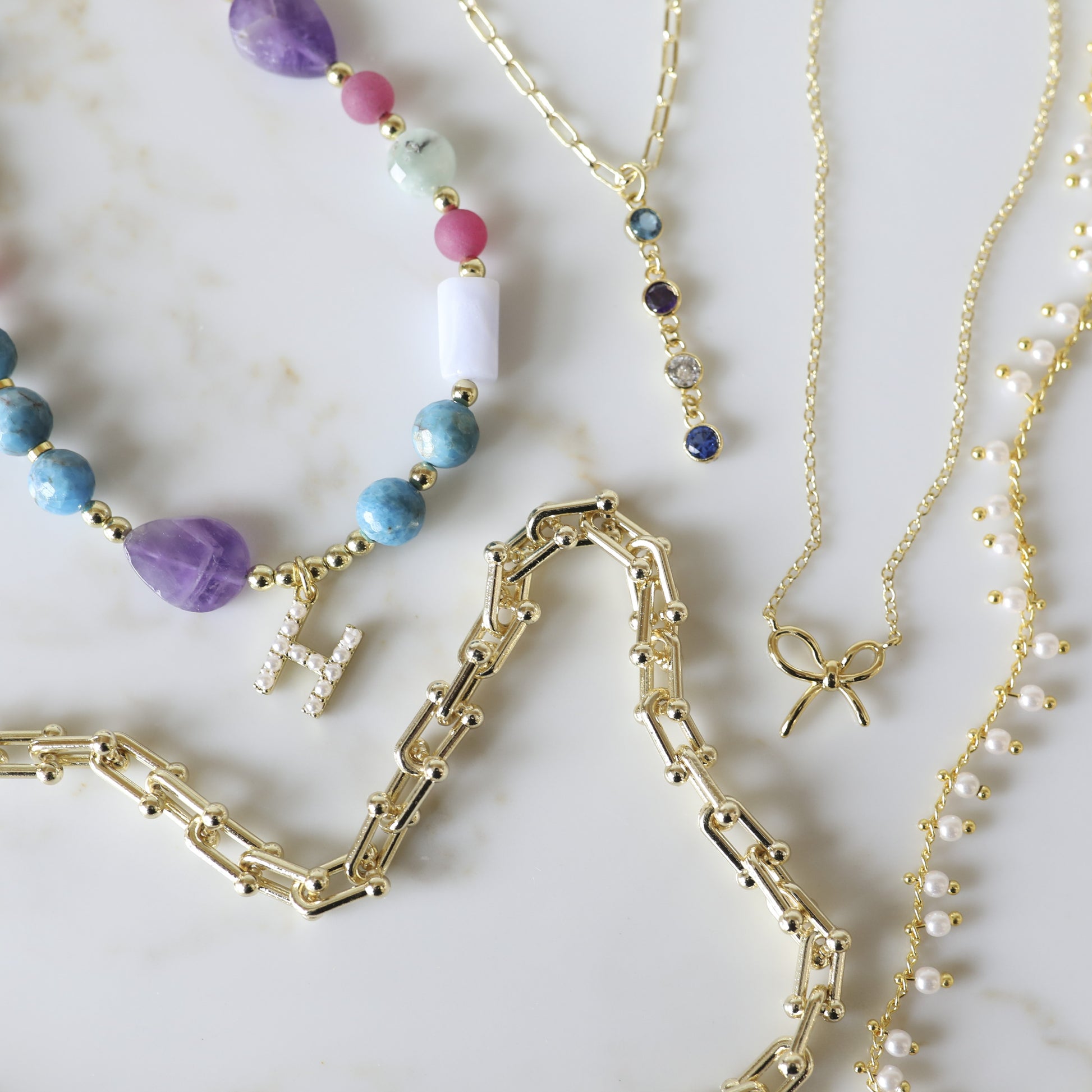The Mini Birthstone Drop Necklace is one of our favorite pieces we launched this summer