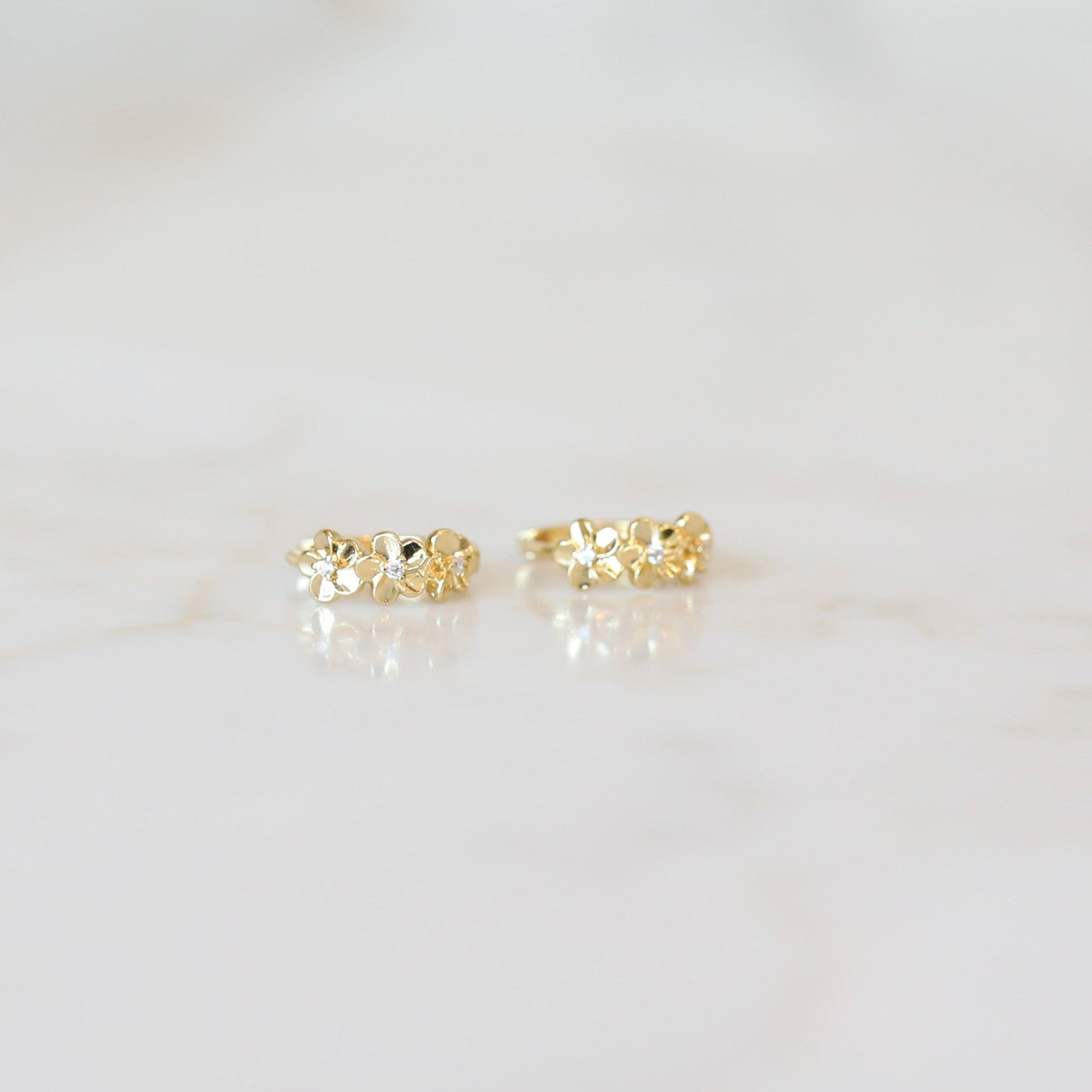 Gold flower huggie hoop earrings