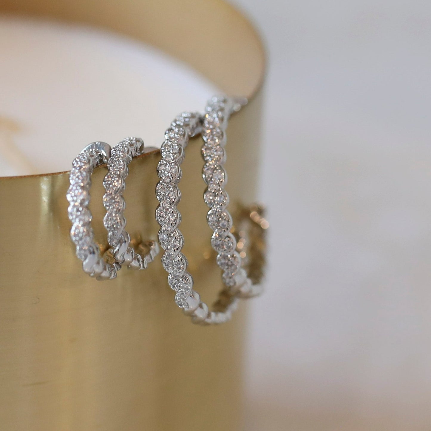 Thin Braided Cubic Zirconia Hoop Earrings in Silver - available in two sizes
