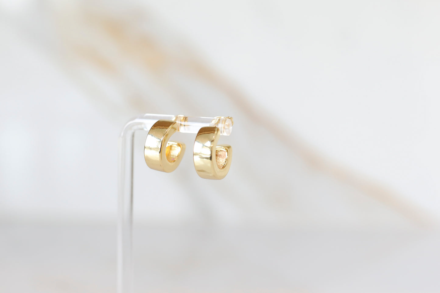Thick Huggie Hoops in Gold