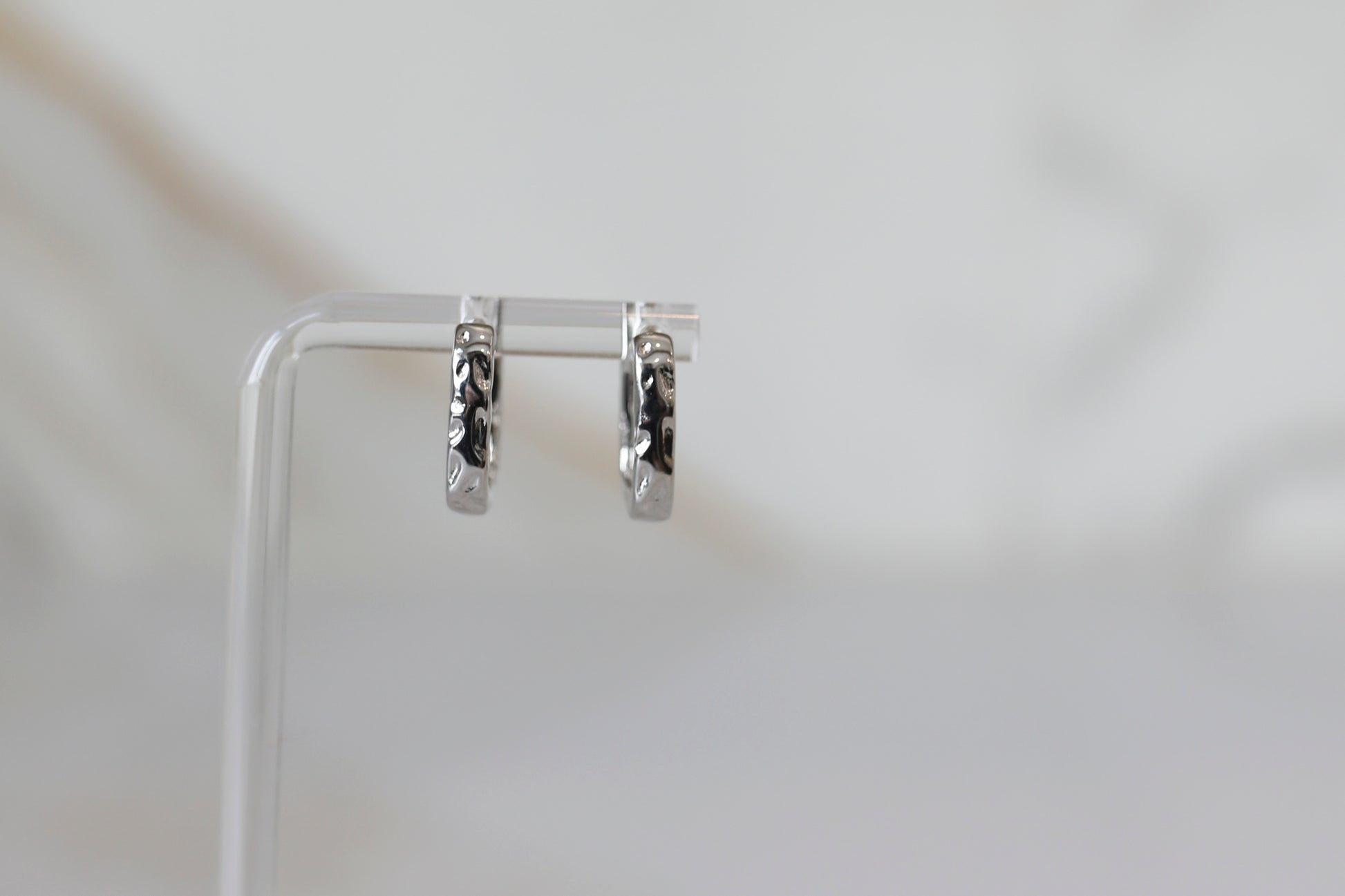 Hammered Huggie Hoops in Silver