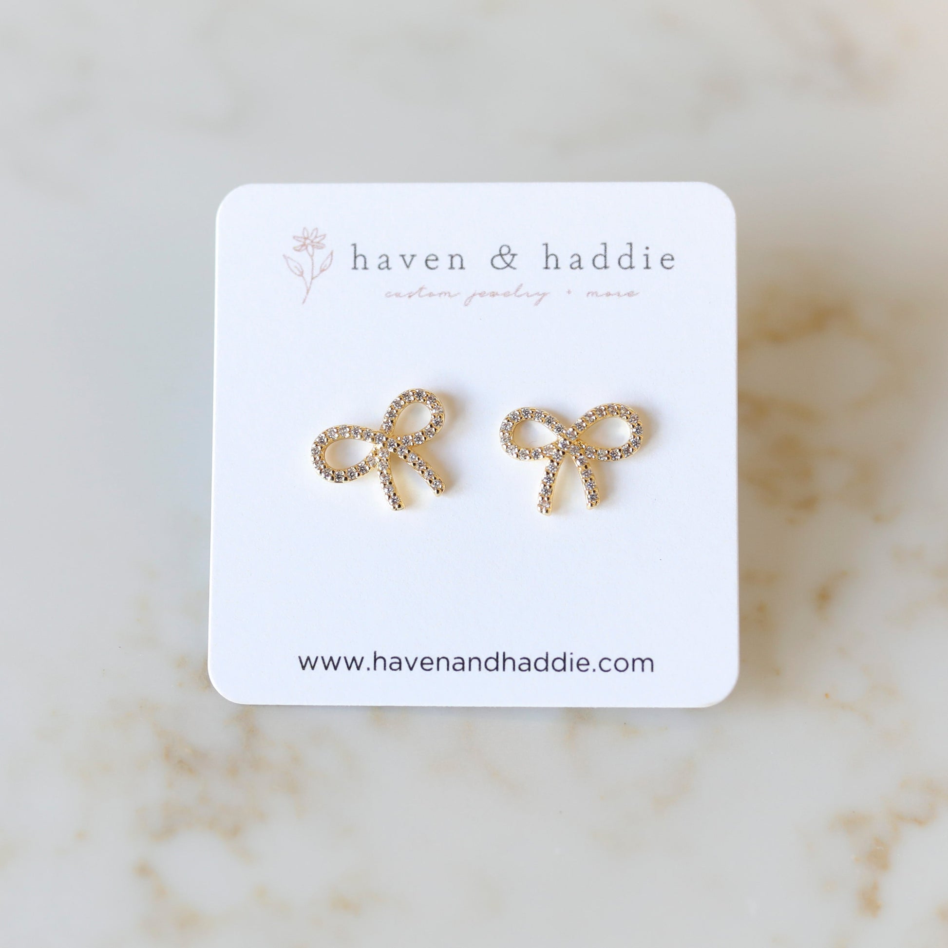 Cubic Zirconia Bow Stud Earrings in Gold